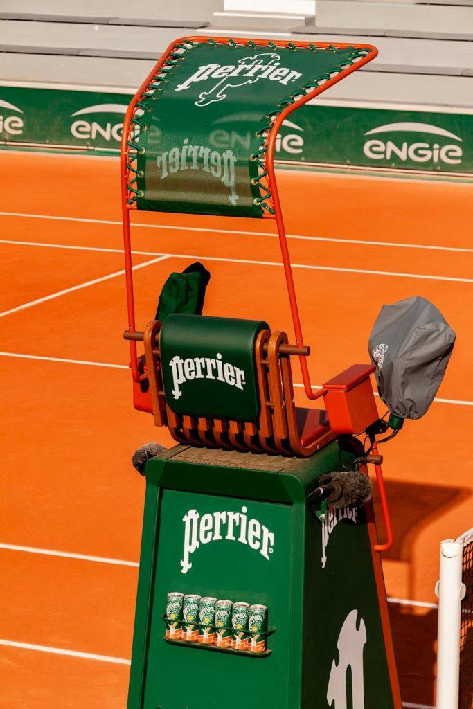 Perrier sparkling water bottle in tennis context, representing premium brands investing in the billion-dollar tennis sponsorship market